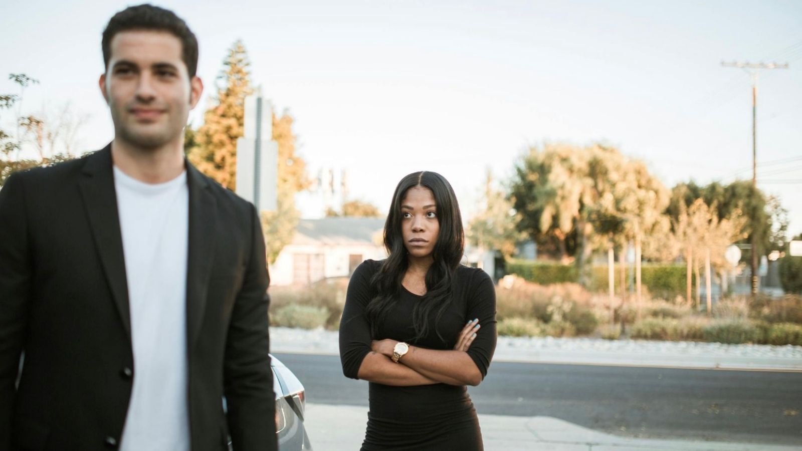 woman glaring at man who is walking away smiling