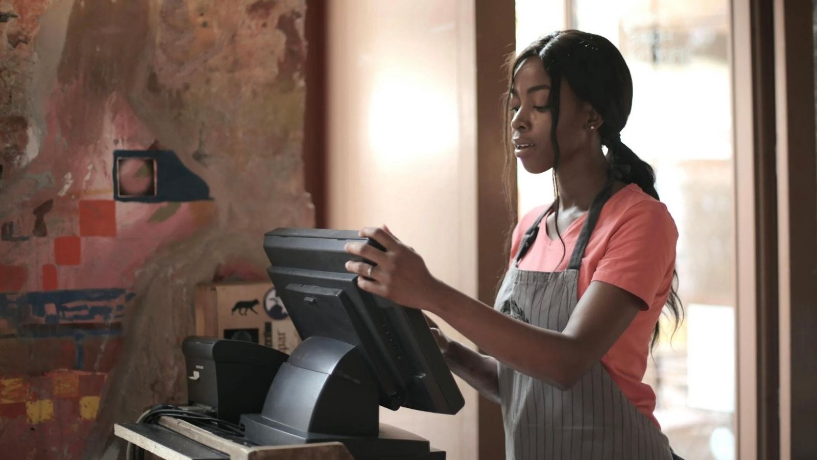 young woman at a cash register