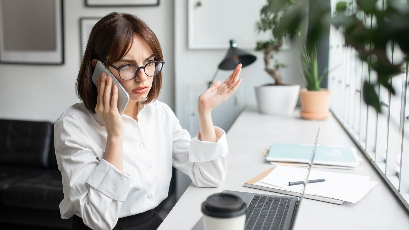 A Boss Banned His Employee From Working Overtime—Then Lied to HR When She Followed the Rules stressed out woman on the phone at work