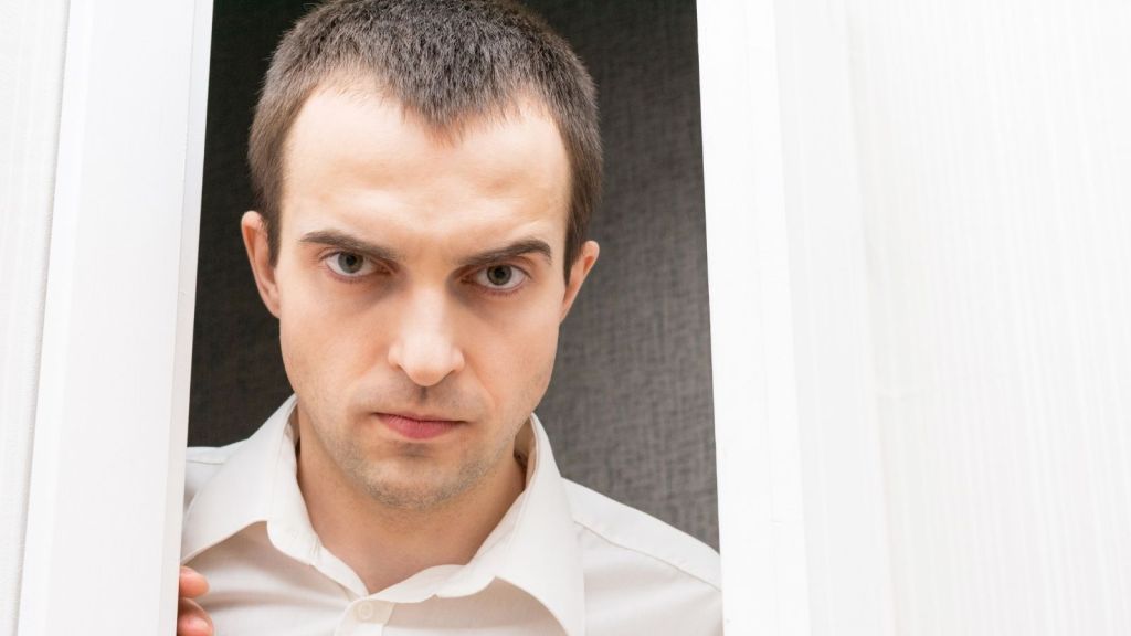 angry man in doorway