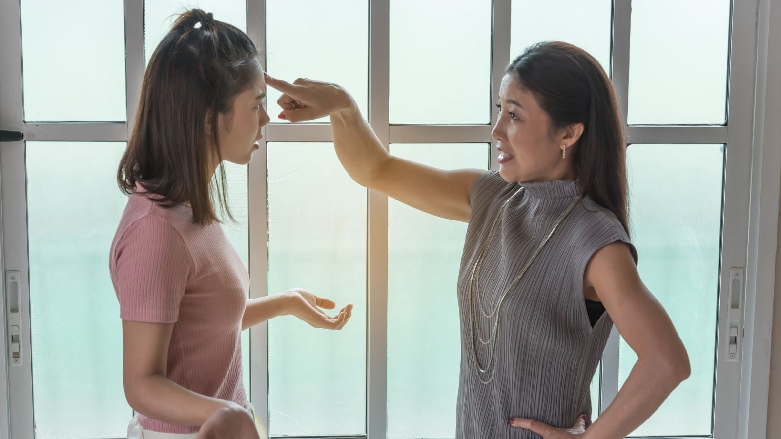 teenage girl arguing with her mom