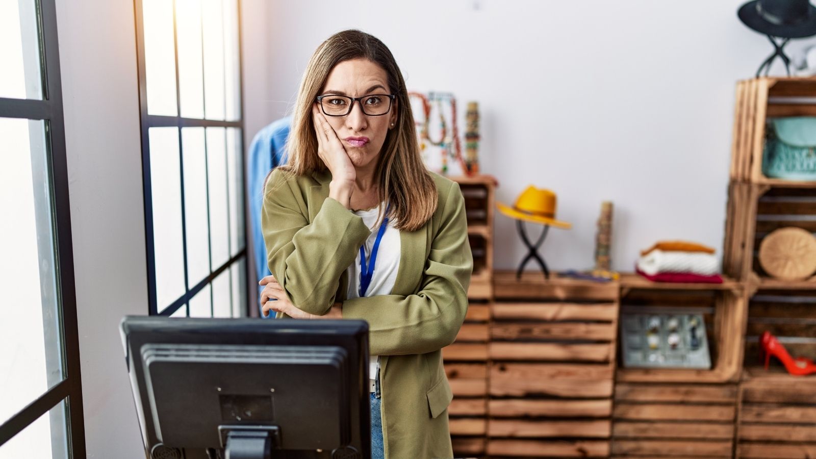 Mid Level Manager Gets Shut Down After Treating Her Equal Coworker Like a Subordinate frustrated retail manager at a cash register