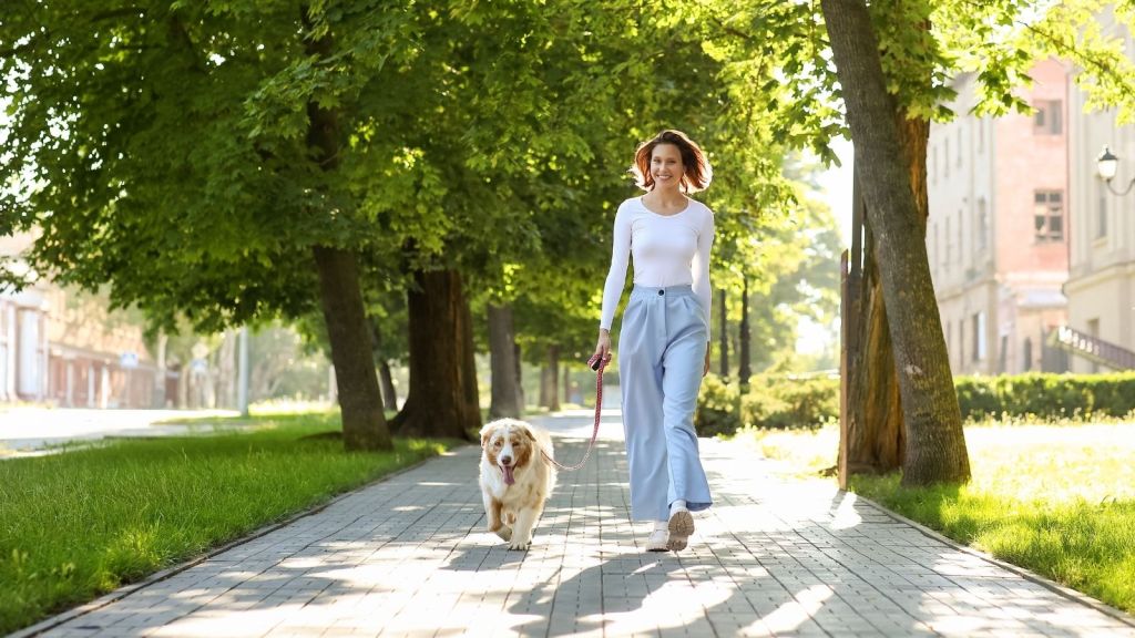 woman walking a dog