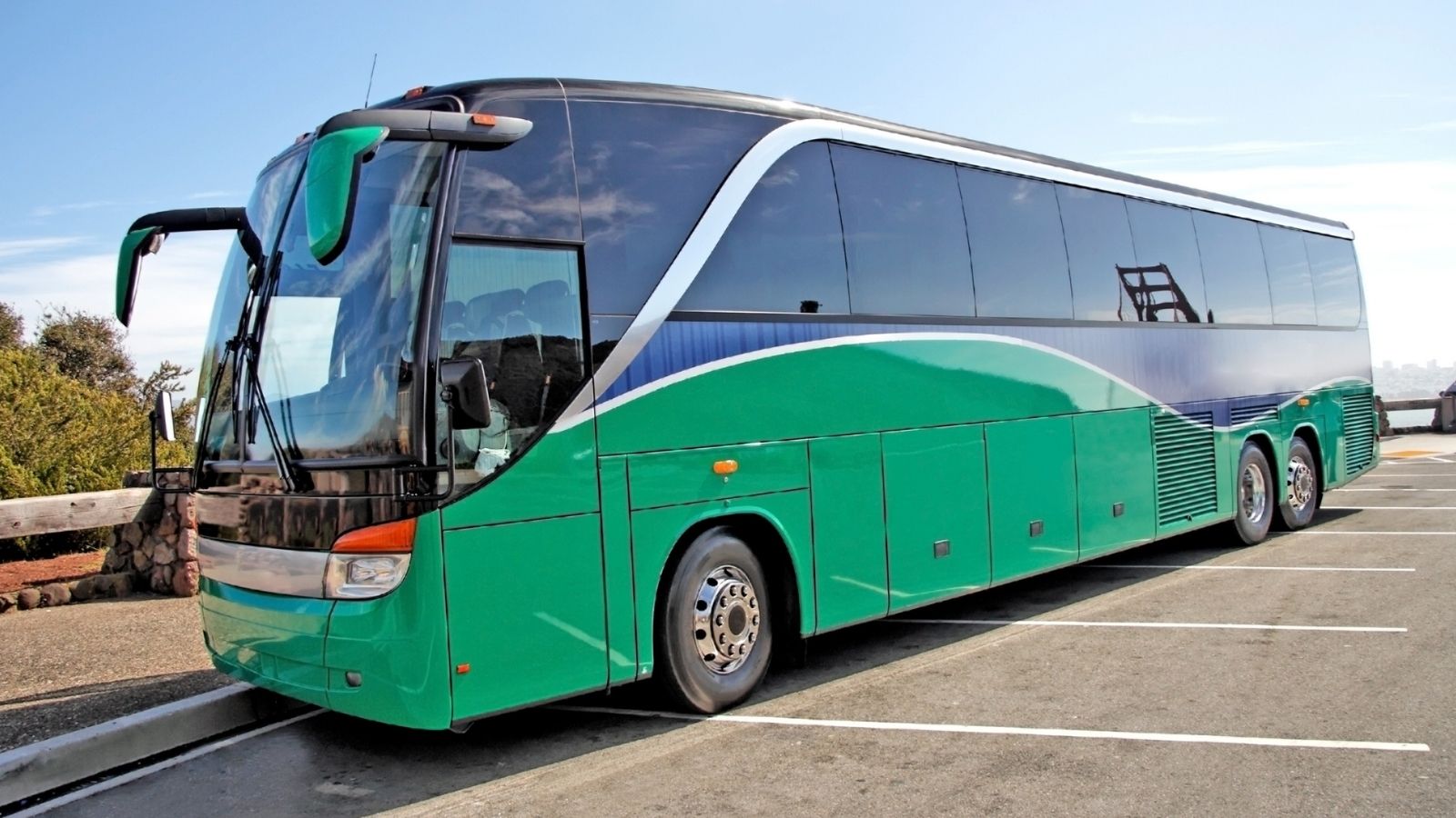 coach bus parked across multiple parking spots