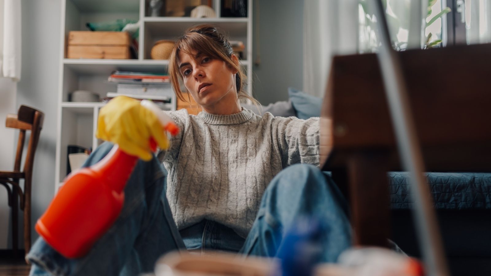 The Ultimate Engagement Red Flag: Outraged Worker Questioning Her Future After Fiancé Explodes Over Housework exhausted young woman holding cleaning supplies