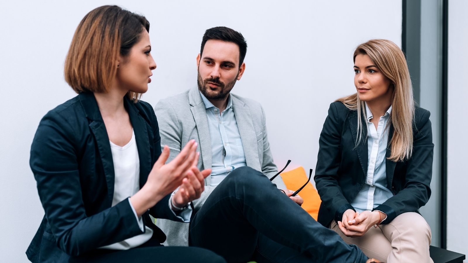 A Supervisor’s Behavior at Work Leaves One Employee Wondering What She Can Even Do three coworkers talking in an office