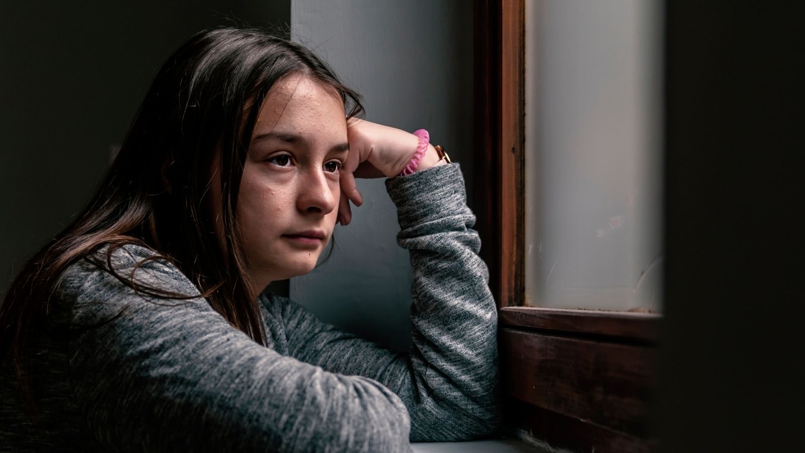 Adult Daughter Questions Whether to Cut Off Father After He Threatens Ex Wife and Children stressed out, sad teenage girl