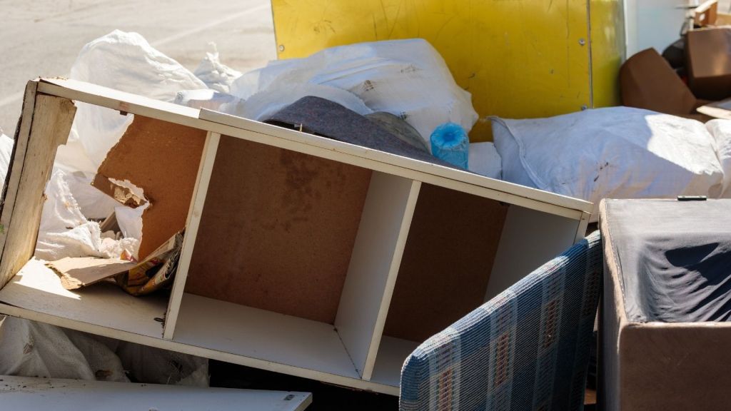 large pile of broken furniture and trash