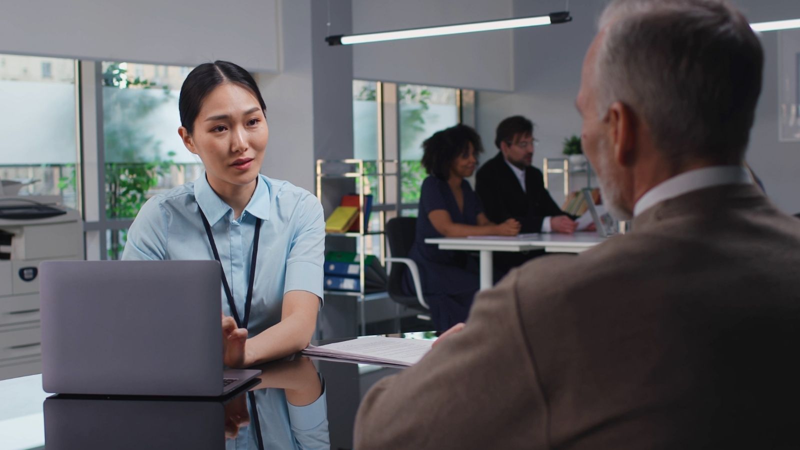 bank teller talking to customer