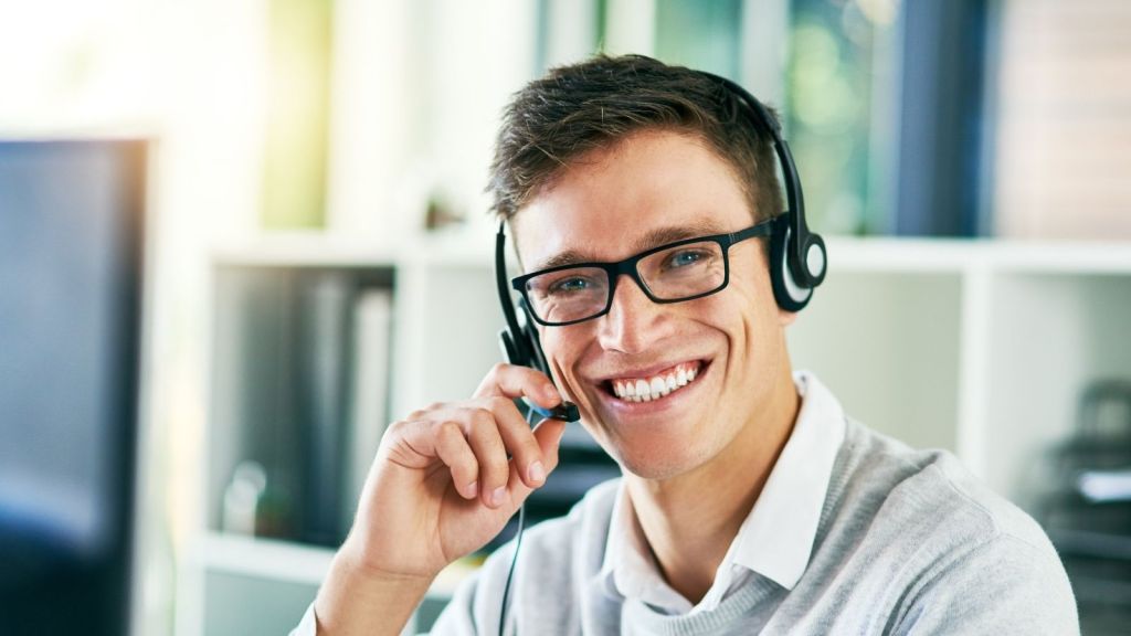 smiling man wearing a headset