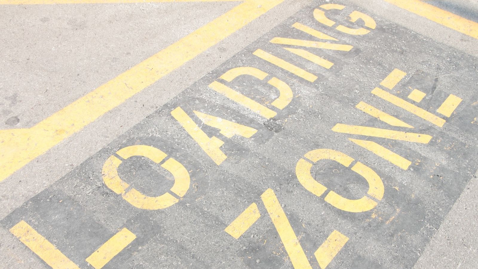 Entitled Woman Parks Her Vehicle in a Loading Zone, so a Delivery Driver Blocks Her In and Calls a Tow Truck "loading zone" painted on the ground in yellow