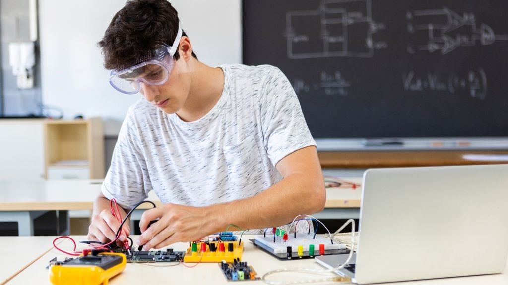 electronics student working on a project