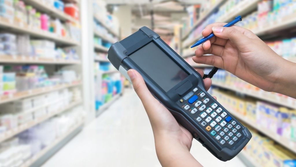 retail worker's hands holding handheld scanner
