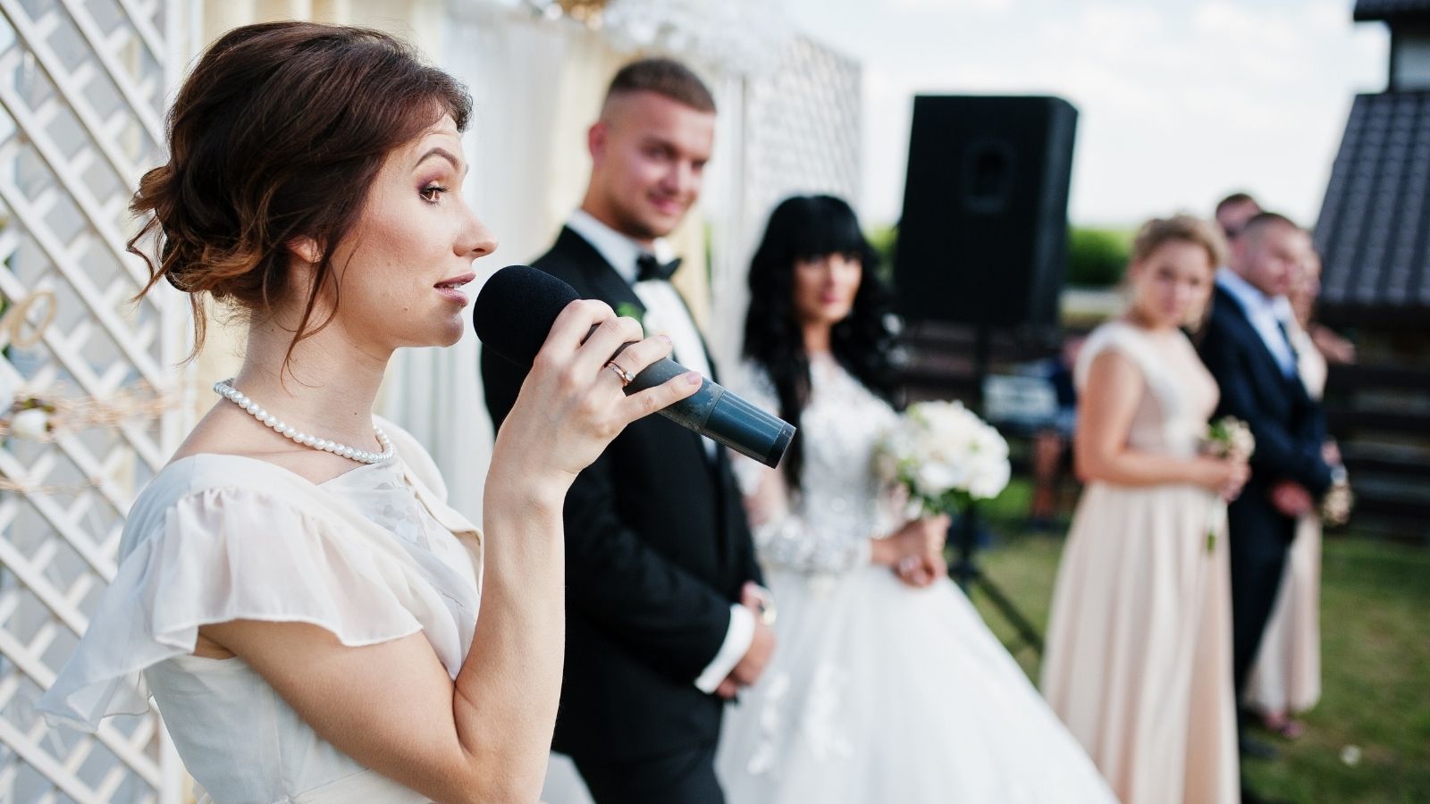 Wedding Guest Is Appalled by the Speeches at the Wedding, so She Feels Bad for the Bride woman giving a speech at a wedding