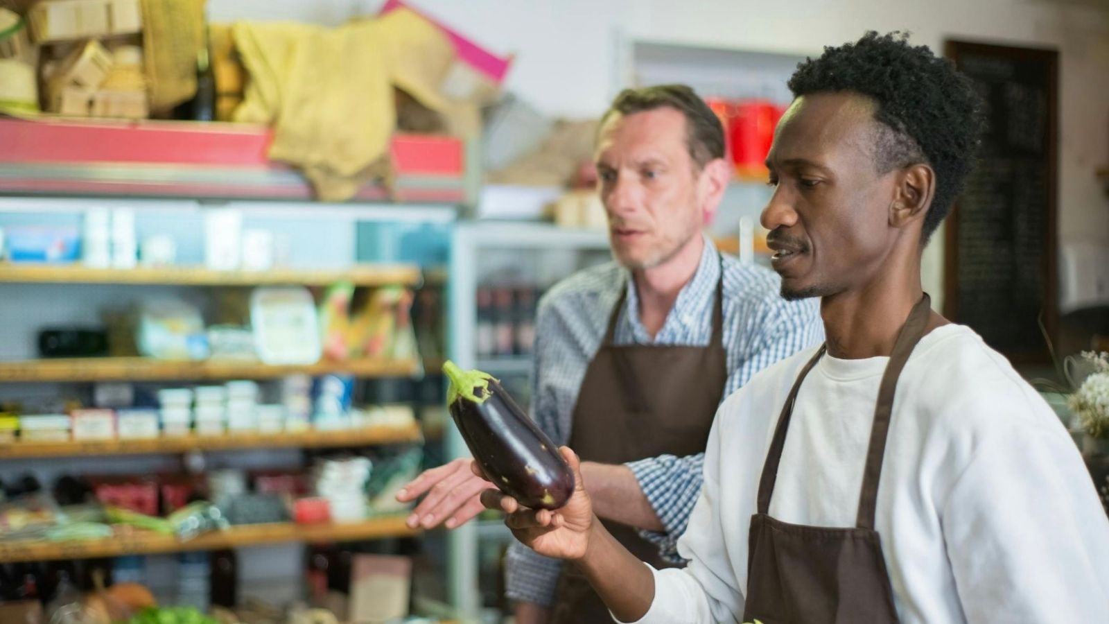two men working in a grocery store