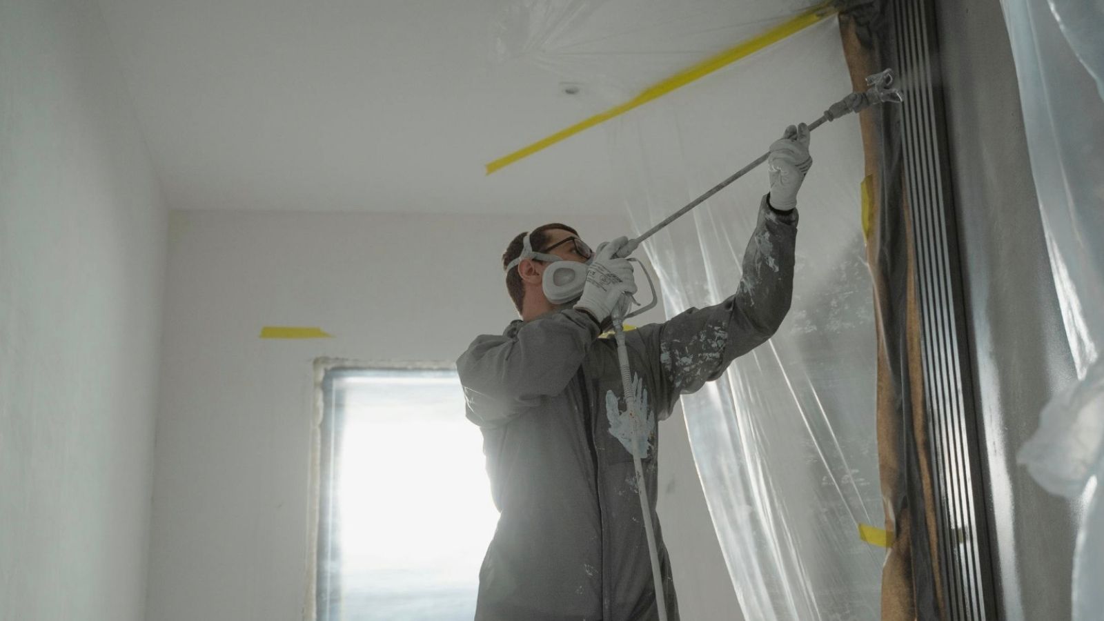 professional painter painting a room
