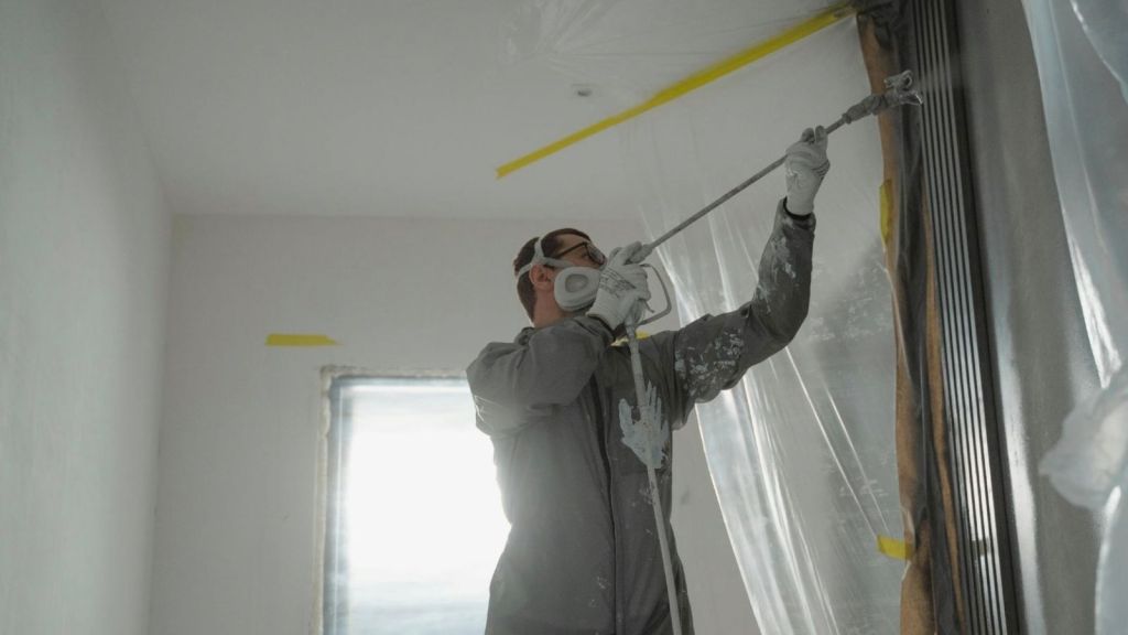professional painter painting a room