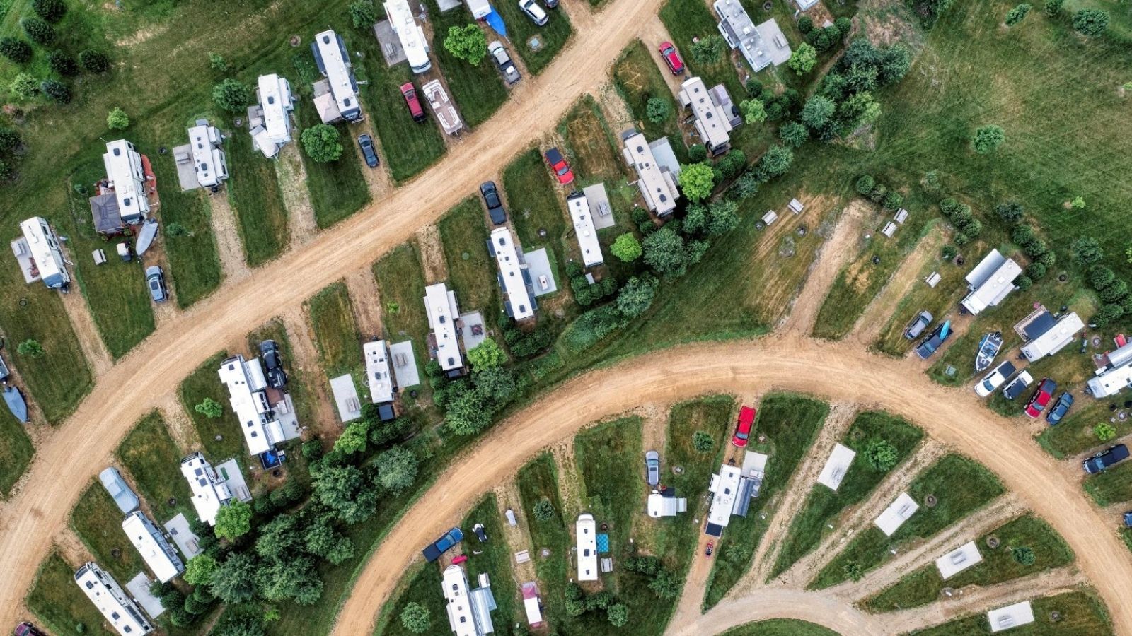 Family Moves Into Trailer Park With Issues, Then a Water Leak Forces Landlord to Take Action aerial shot of a trailer park