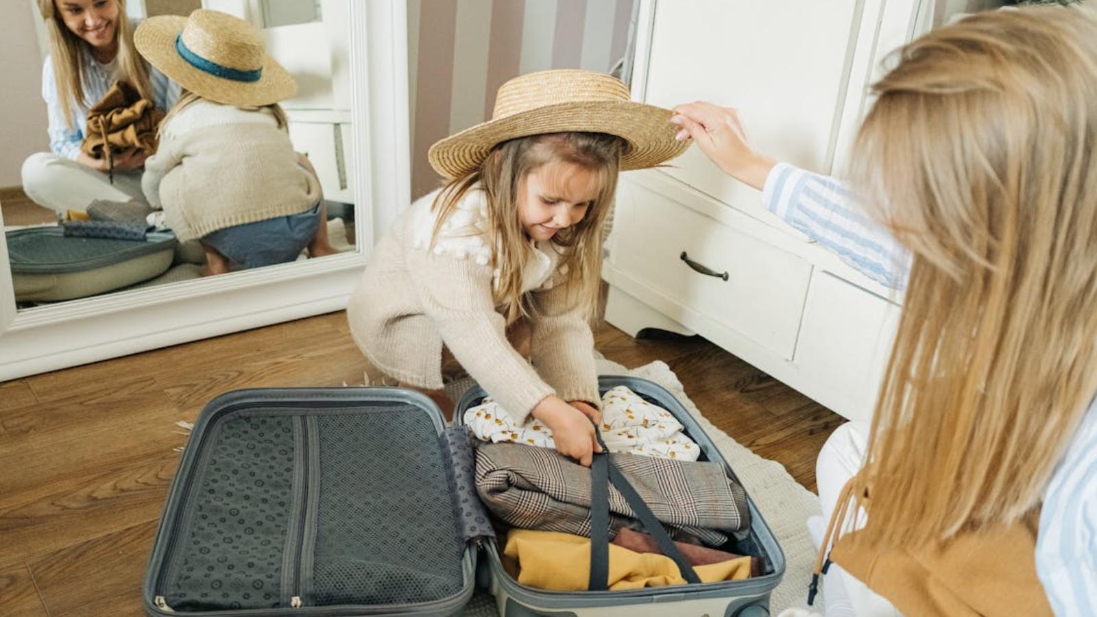 Mom and daughter packing for a trip