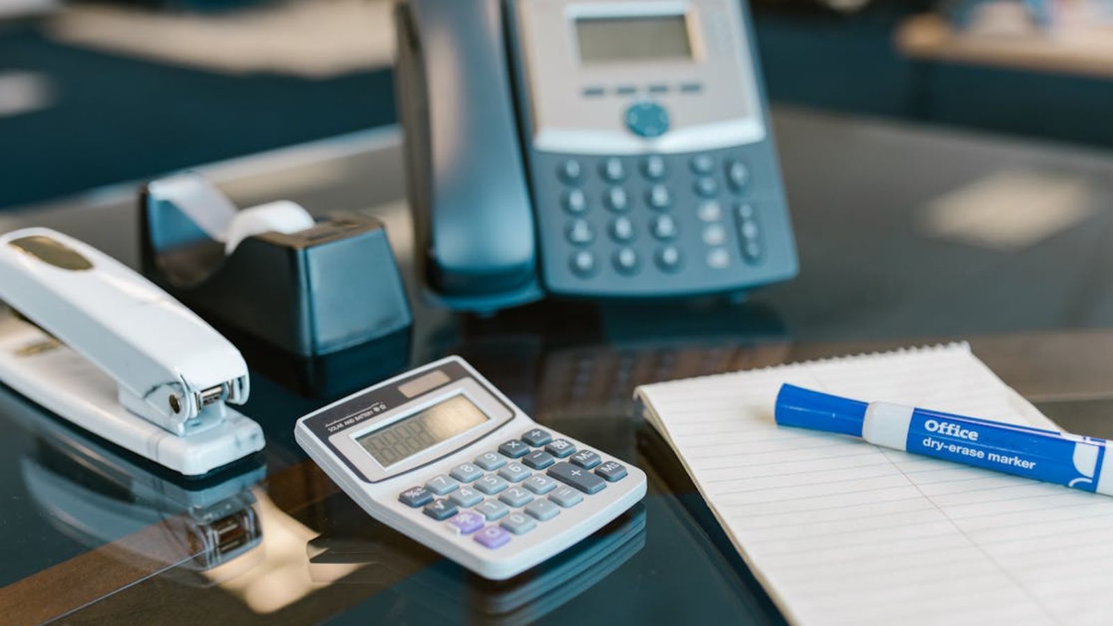 A Coworker Kept Labeling Random Office Supplies—So She Launched an Equally Petty Counter War Office supplies on a desk