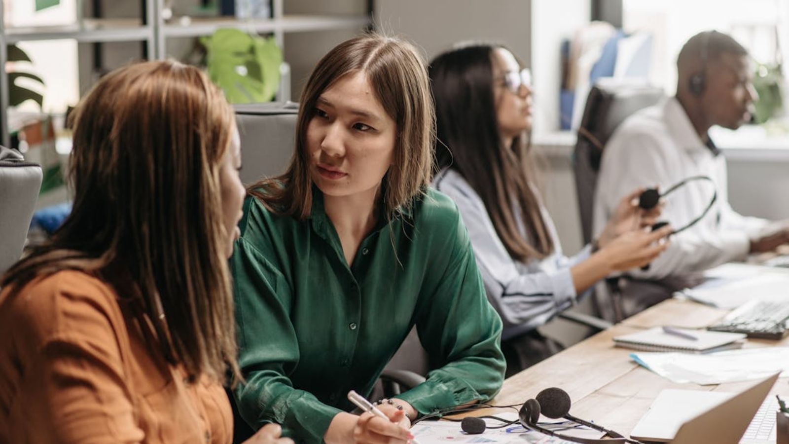 Female employees chatting in the office