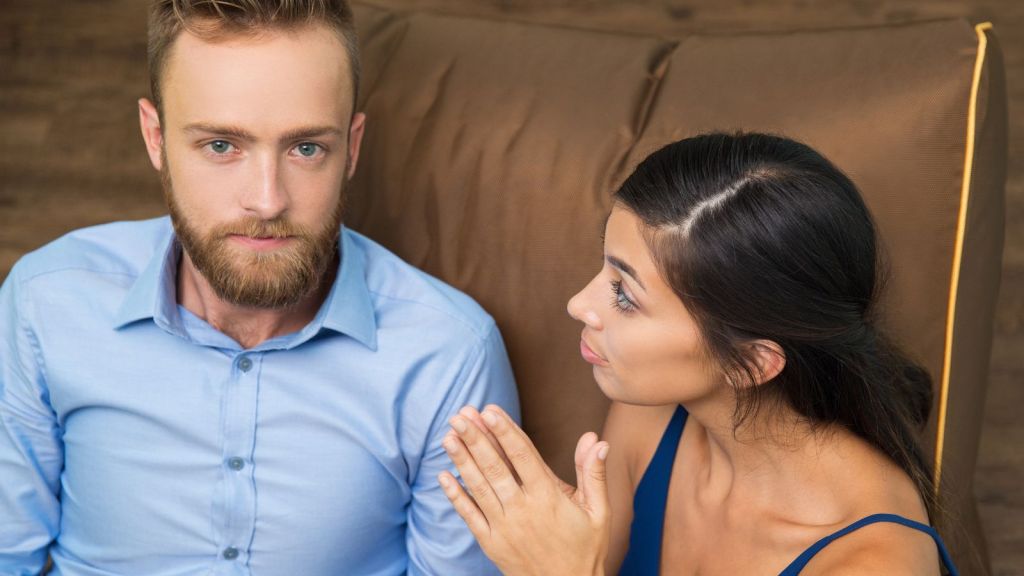 Woman talking to her husband with her hands together