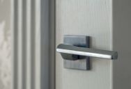 Woman Grows Concerned After Neighbor Repeatedly Tries to Open Her Front Door