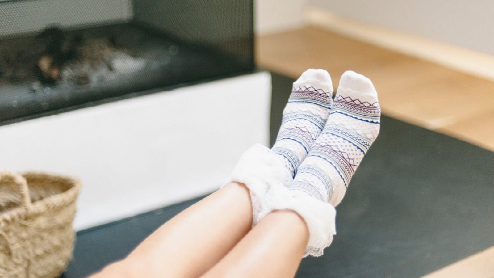 Woman's legs with cute socks on the feet