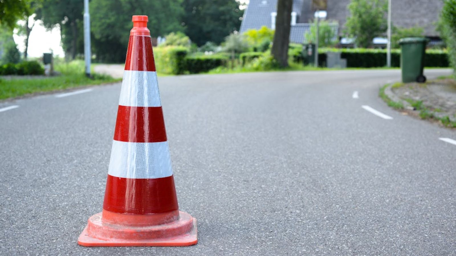 He Suffered Through a Neighbor’s Obsessive Parking Rules Until His Family Guests Were Suddenly Targeted An orange cone on the road