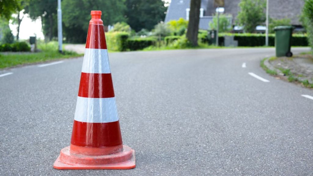 An orange cone on the road
