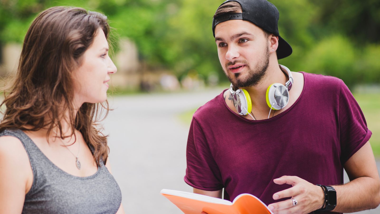 Man and woman having a serious discussion outdoors