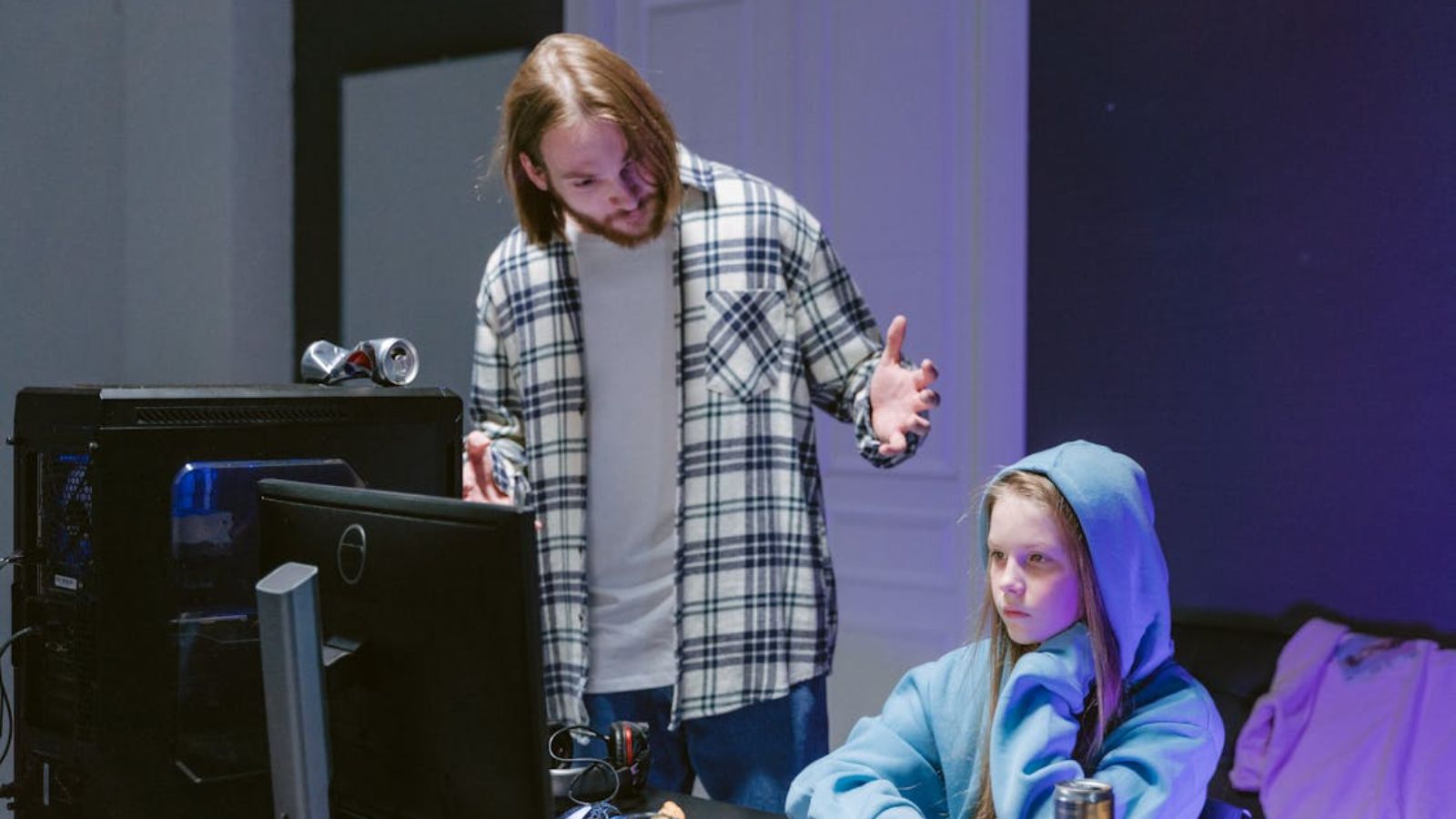 A Father Daughter Dynamic Takes an Unexpected Turn After a New Boyfriend Enters the Picture Man talking to a teenage girl while in front of computer