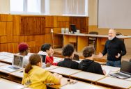 A Professor Insisted on Starting His Class on Time, so He Entered the Classroom Despite Another Professor Still Doing a Presentation
