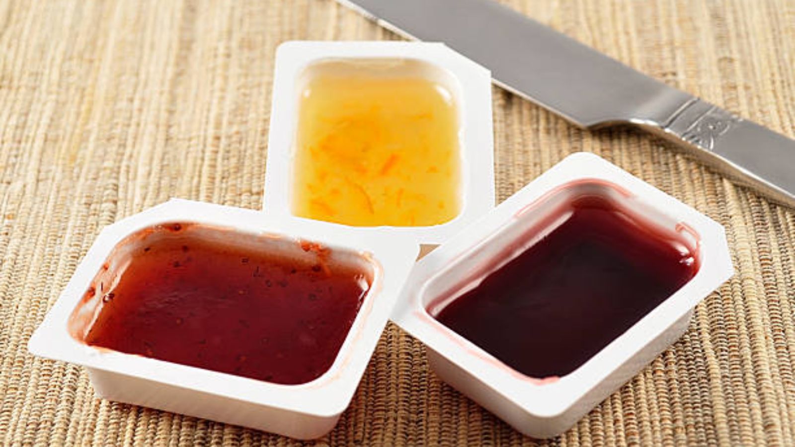 Woman Watches Friend Waste Jam by Opening Multiple Containers, Then Teaches Her a Quiet Lesson Assorted jelly marmalades in small rectangular containers