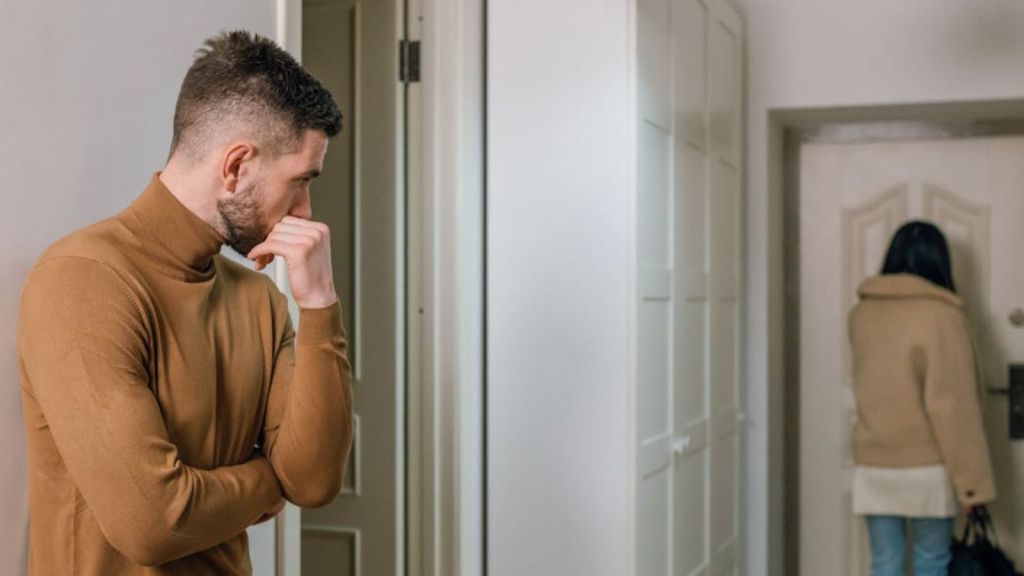 Man watching his girlfriend walks out of the computer