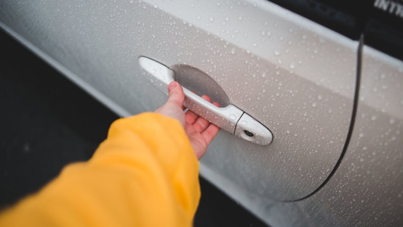 Woman opening a car door