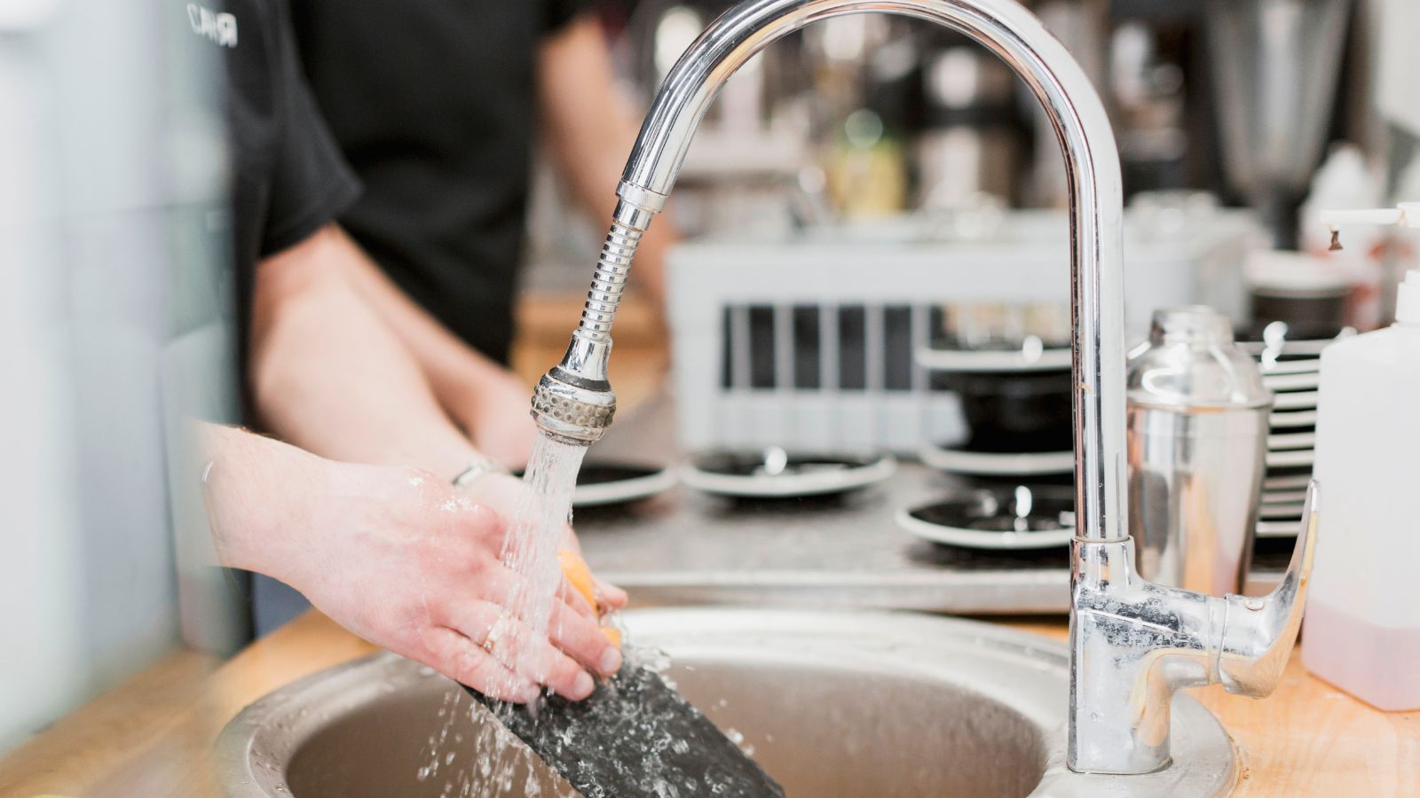 A Busy Mother’s Day Service Brings a Restaurant Team Together in Unexpected Ways Restaurant workers washing dishes in the kitchen