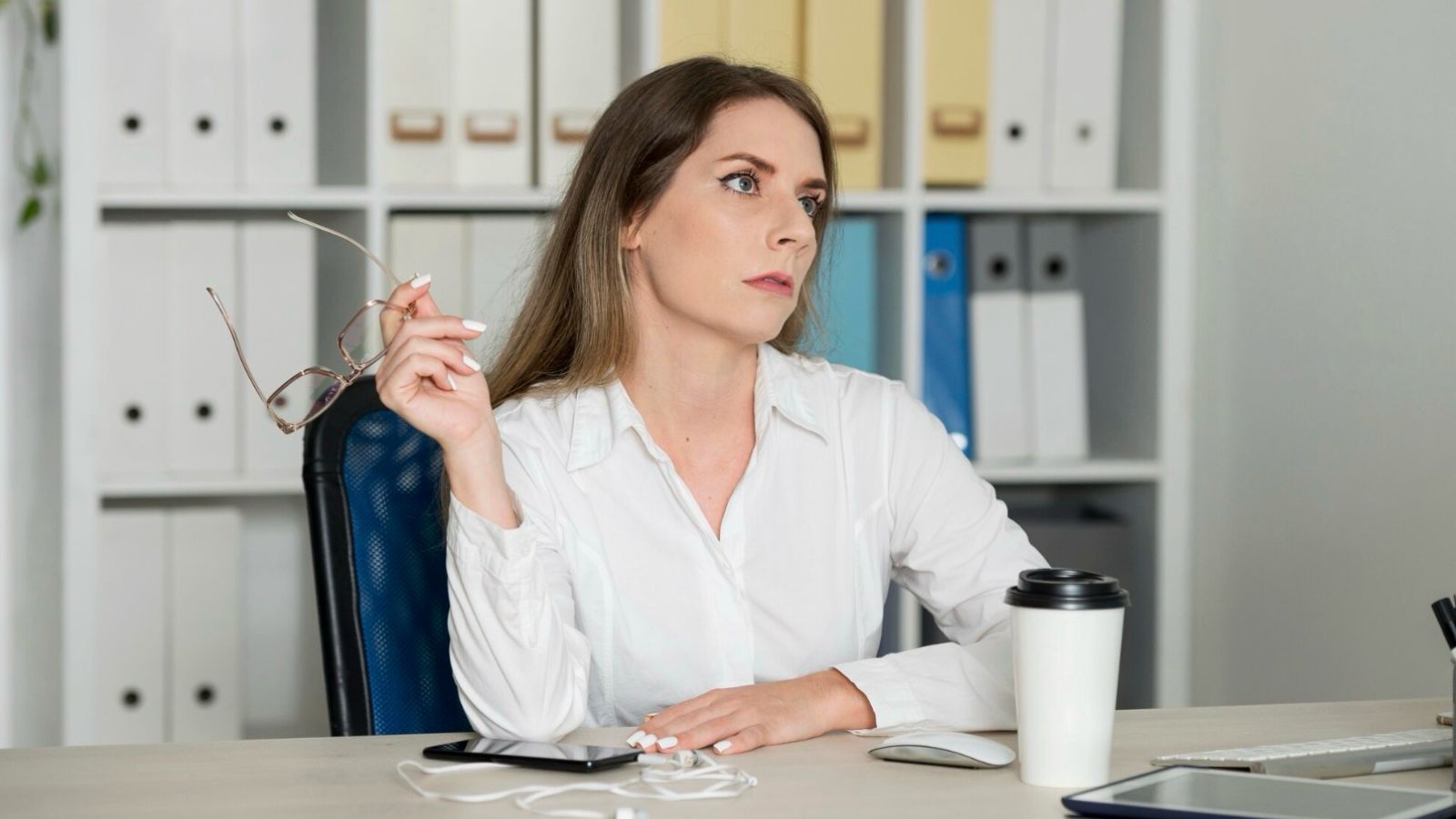 Woman lookng grumpy at work