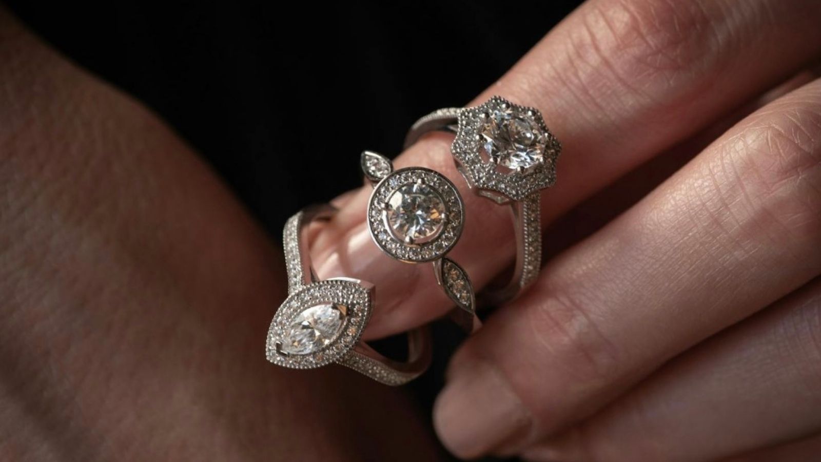 Woman Is Excited to Pick Out Her Engagement Ring, but Her Dad Is Upset Her Boyfriend Didn’t Ask for Her Hand in Marriage closeup of three wedding rings on woman's finger