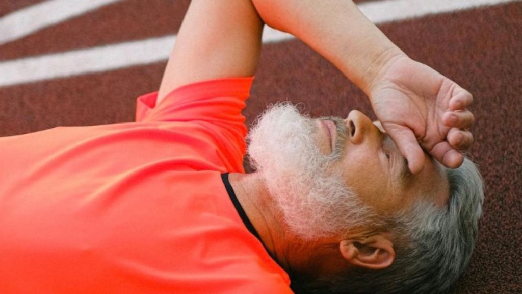 man lying down due to heat stroke