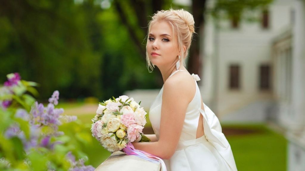 bride standing outside with a serious expression