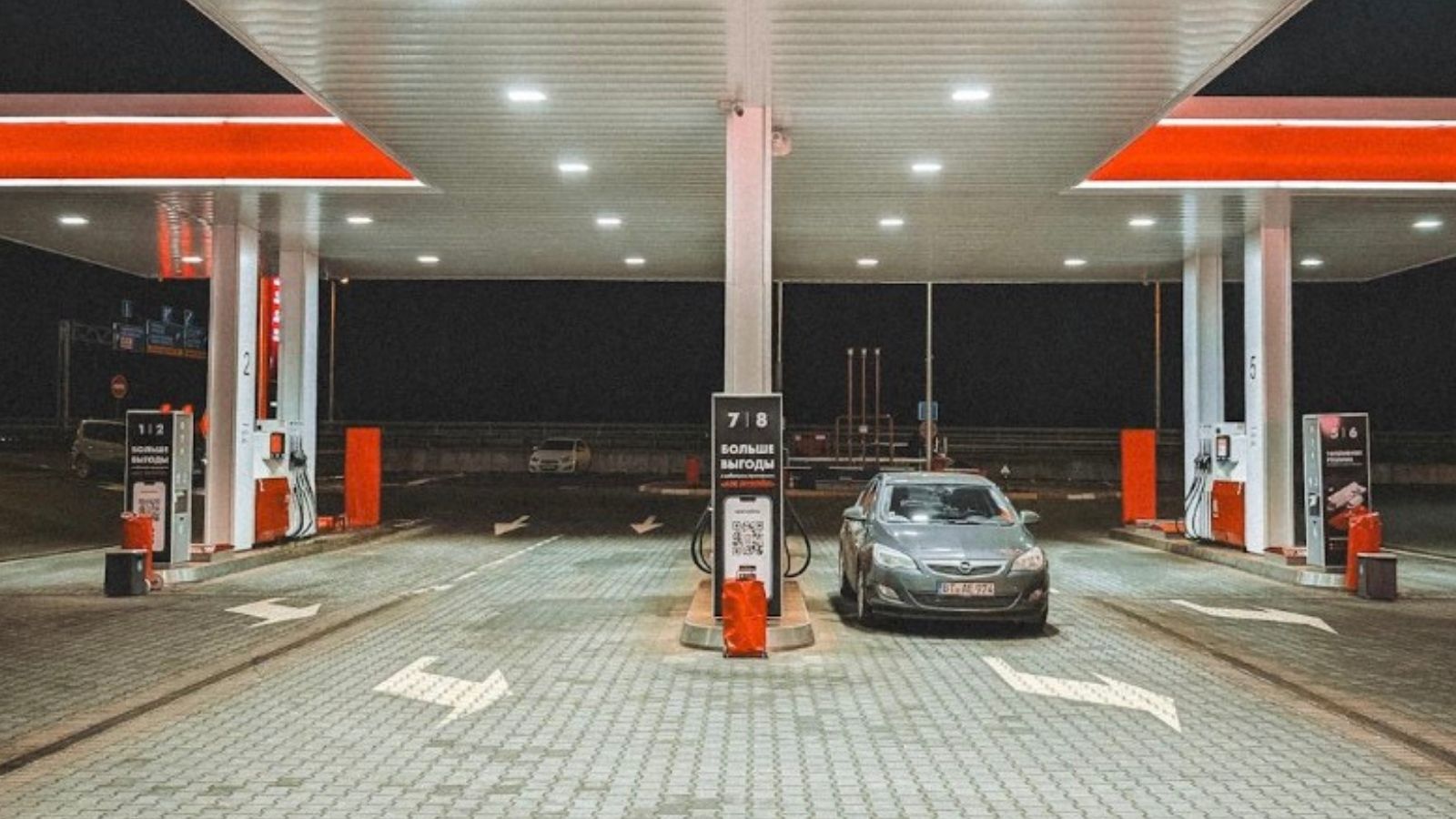 car at a gas station at night