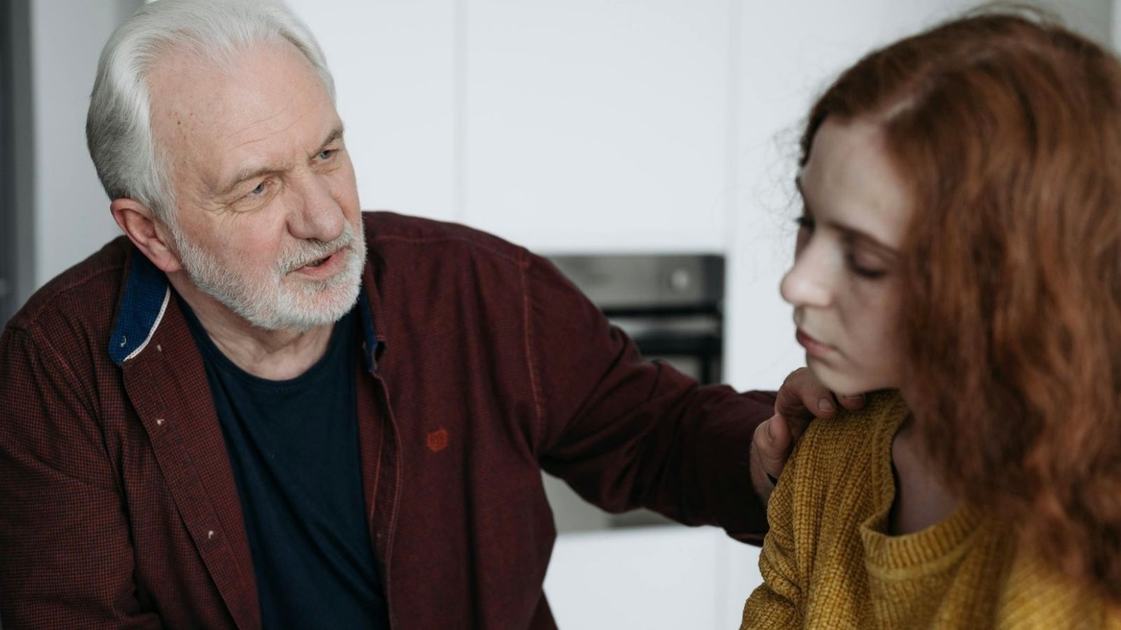 A Neighborhood Situation Gets Awkward When One Woman Speaks Up About a Creepy Neighbor older man putting his hand on young woman's shoulder