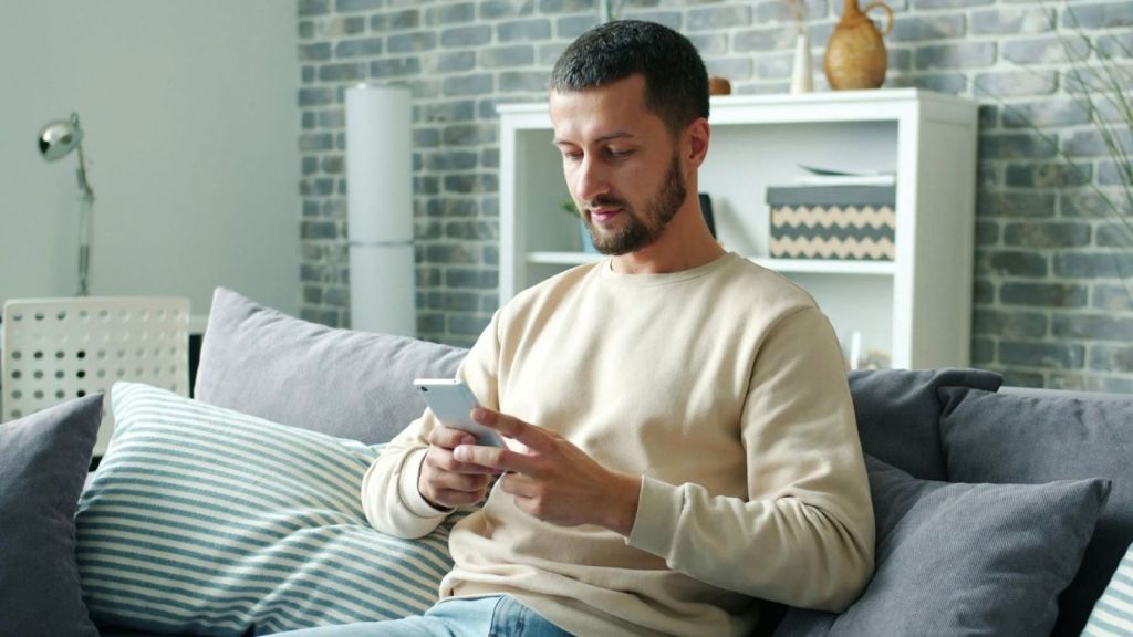 man looking at his phone
