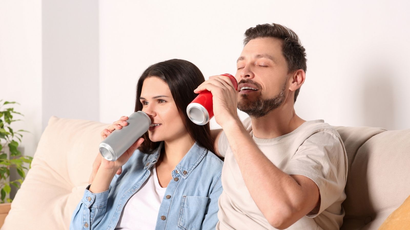 One Sibling Acts Entitled About Food and Soda in the House, Leaving the Other Feeling Upset young couple drinking soda