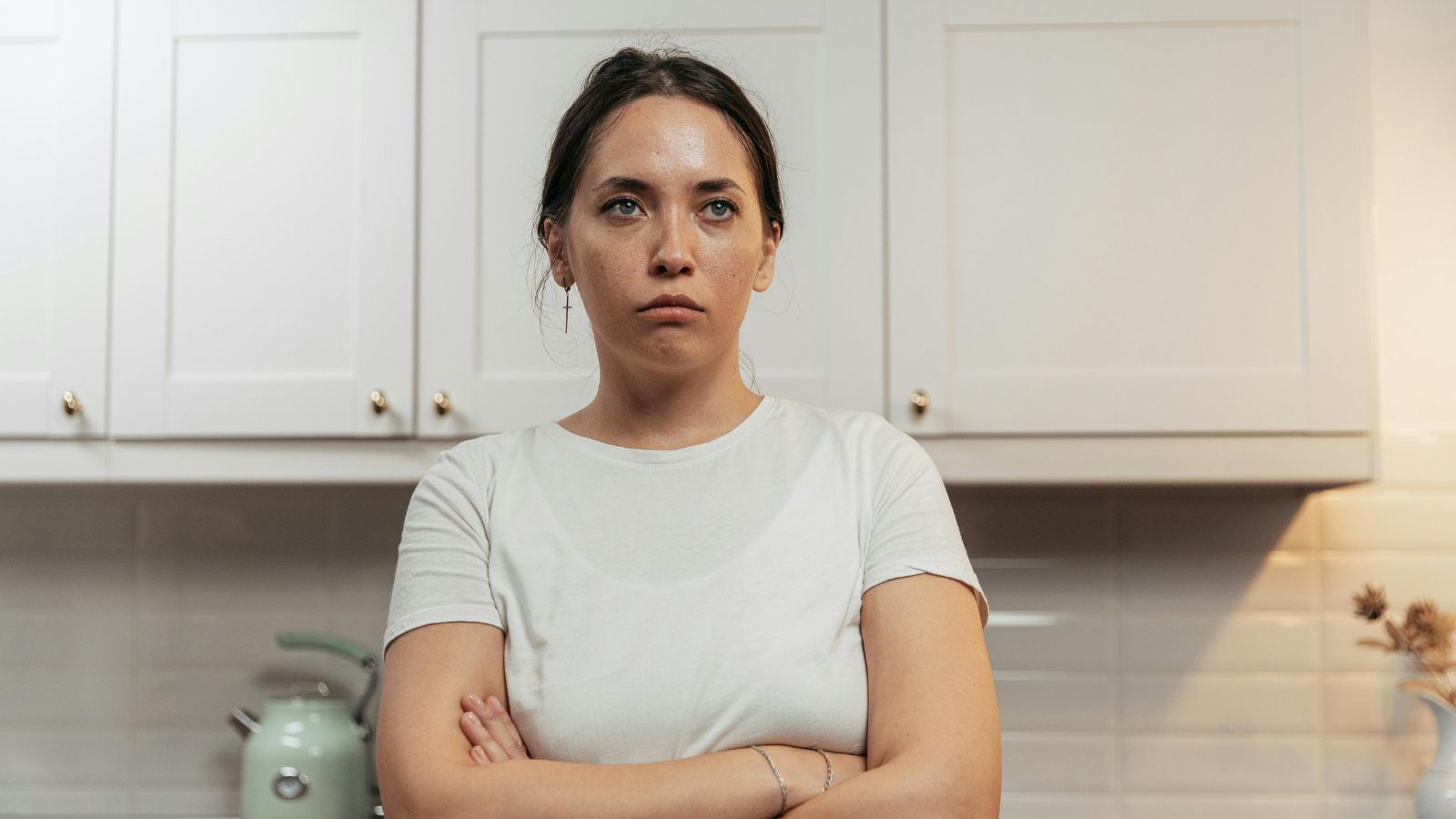 Woman in white shirt upset