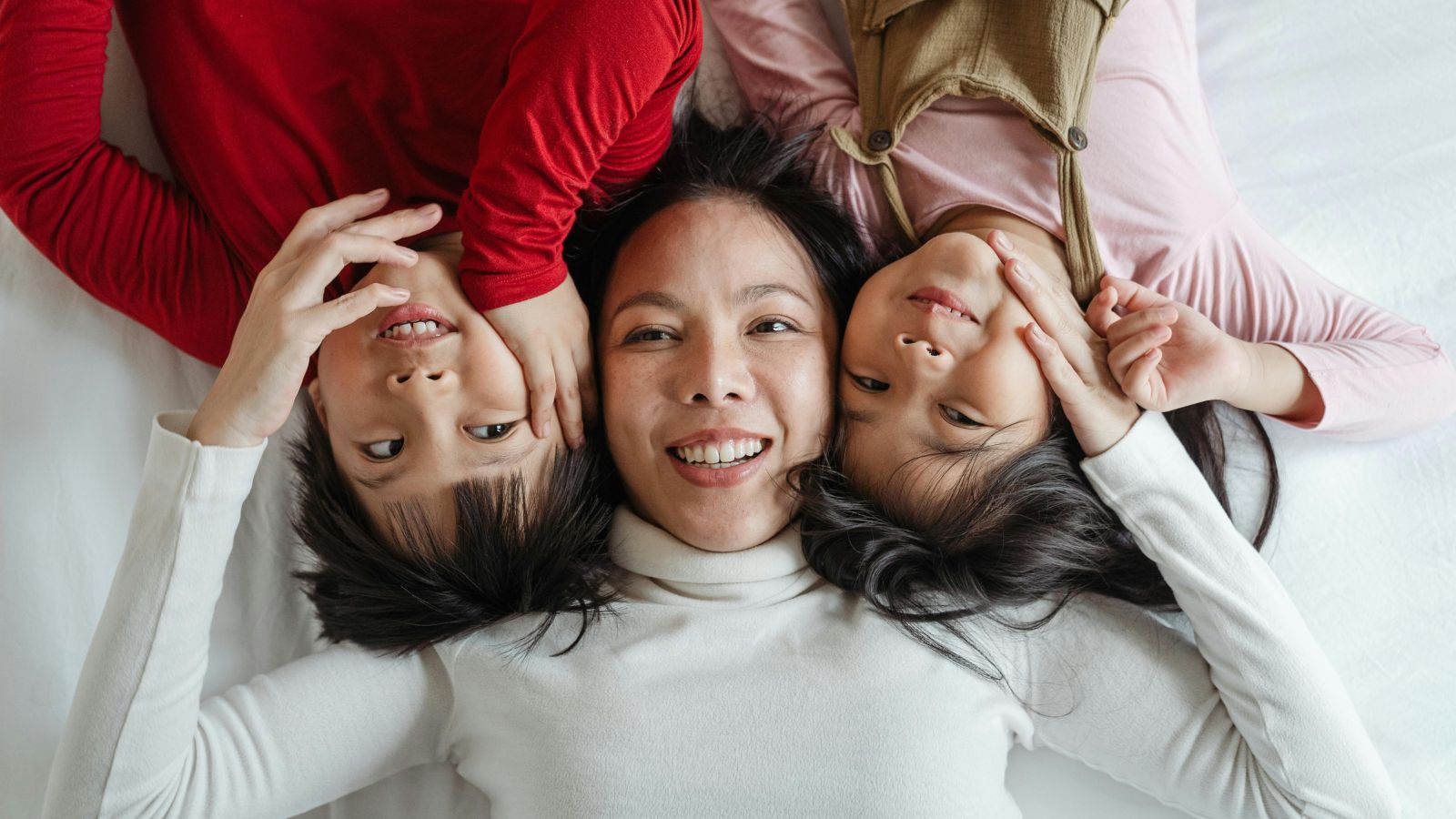 Woman playing with two kids
