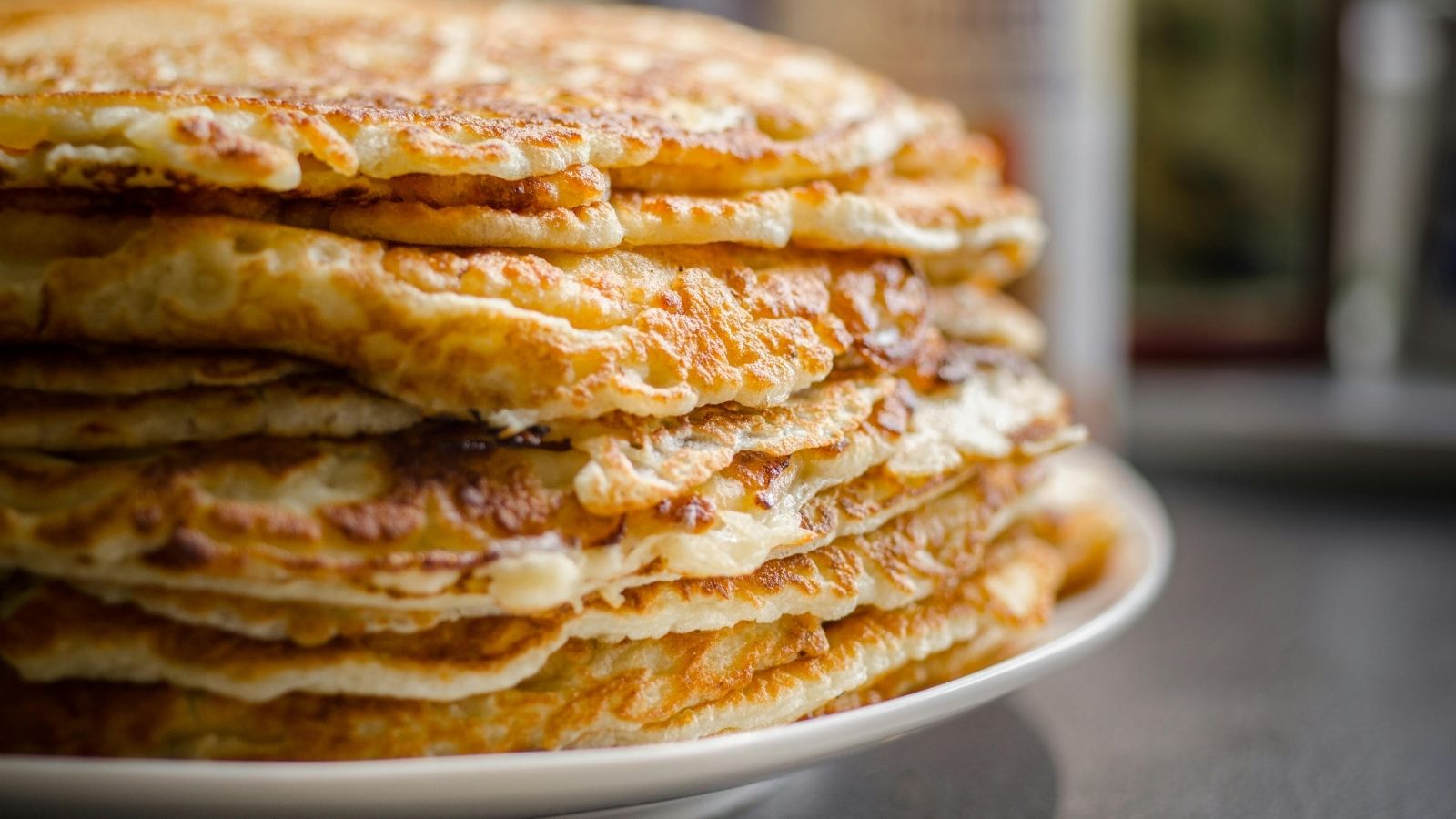 A large stack of huge pancakes