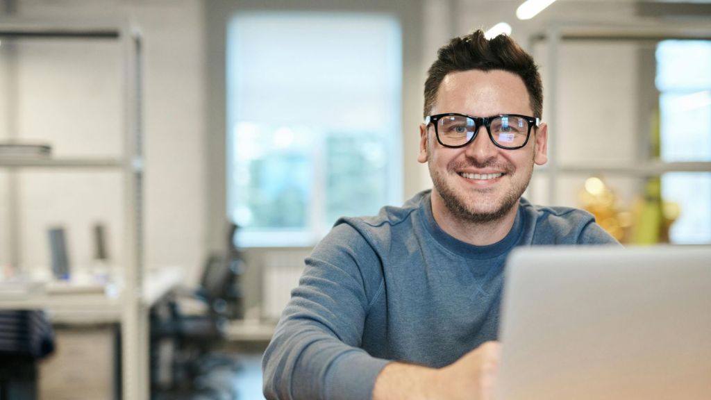 Man in glasses working