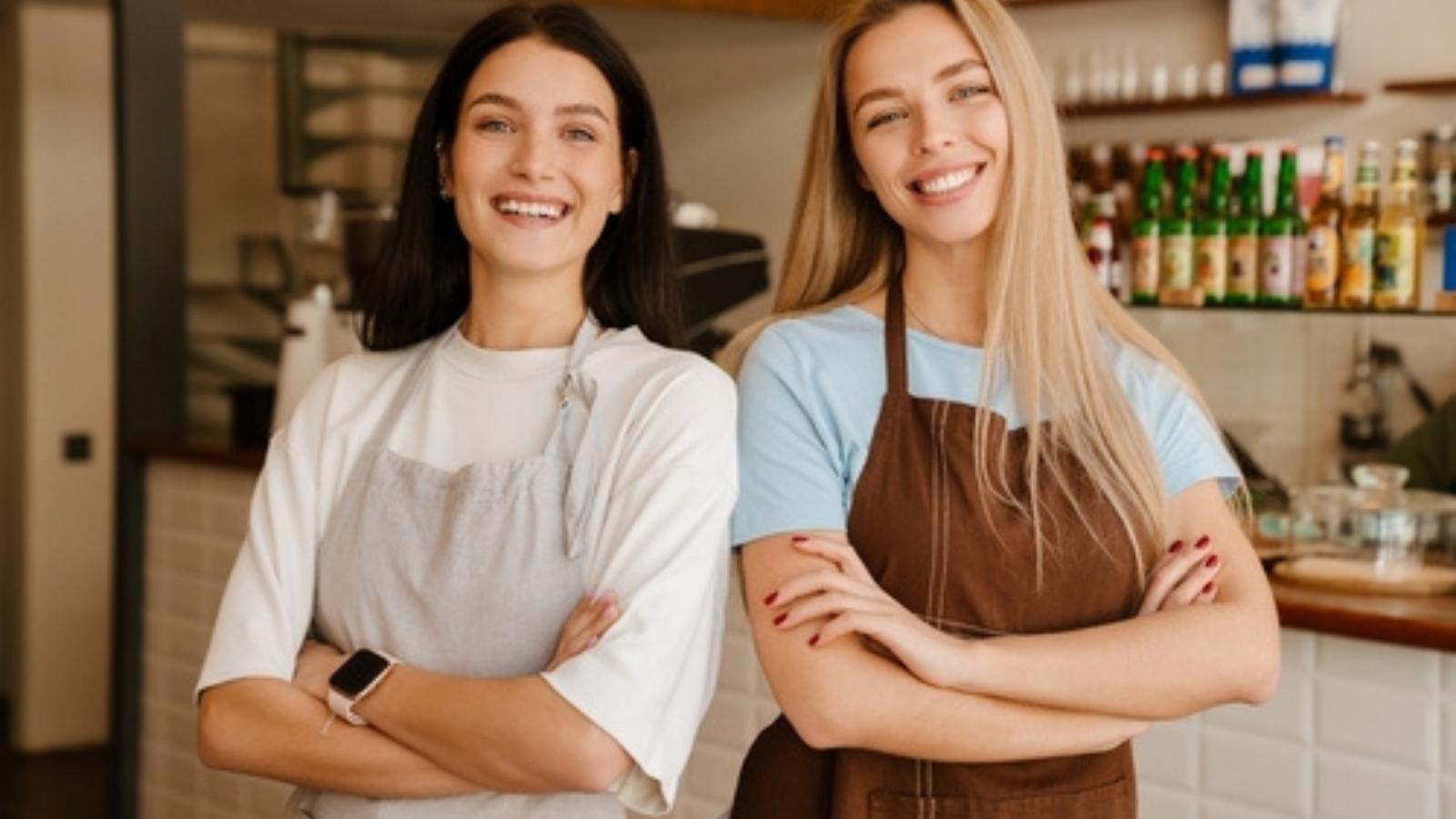 Restaurant Staff Walks Out After Manager Fires Two Hostesses Over Loose Hair Strands Two happy waitresses